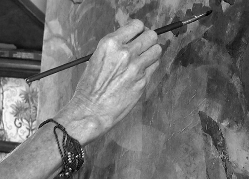 Close-up of painting hand